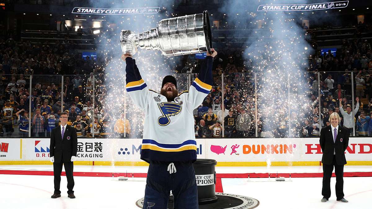 St. Louis Blues players celebrate lifting the Stanley Cup after the final game in 2019