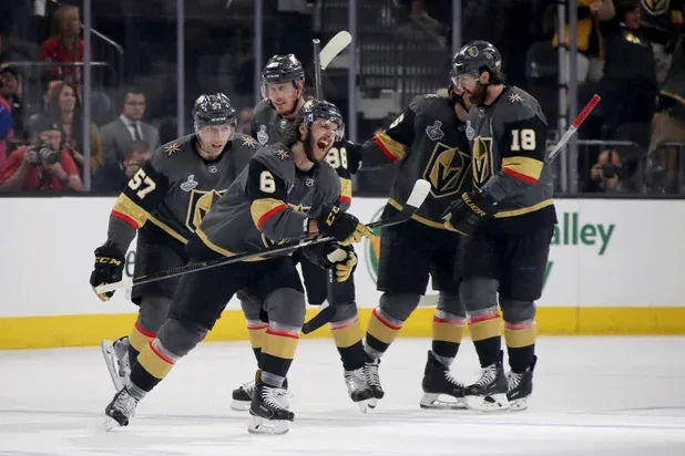 Mark Stone embracing teammates after scoring a decisive playoff goal