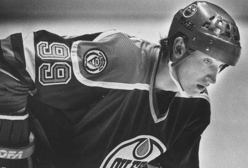 Close-up of Wayne Gretzky's Los Angeles Kings wooden hockey stick showing tape pattern and blade wear