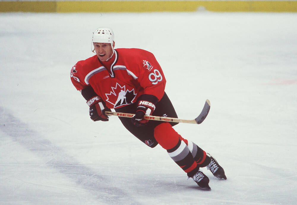 Guy Lafleur in a Quebec Remparts uniform carrying the puck during a junior-era game