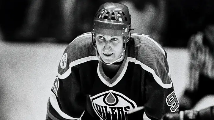 Wayne Gretzky controlling the pace of play with the puck, dictating tempo against opponents