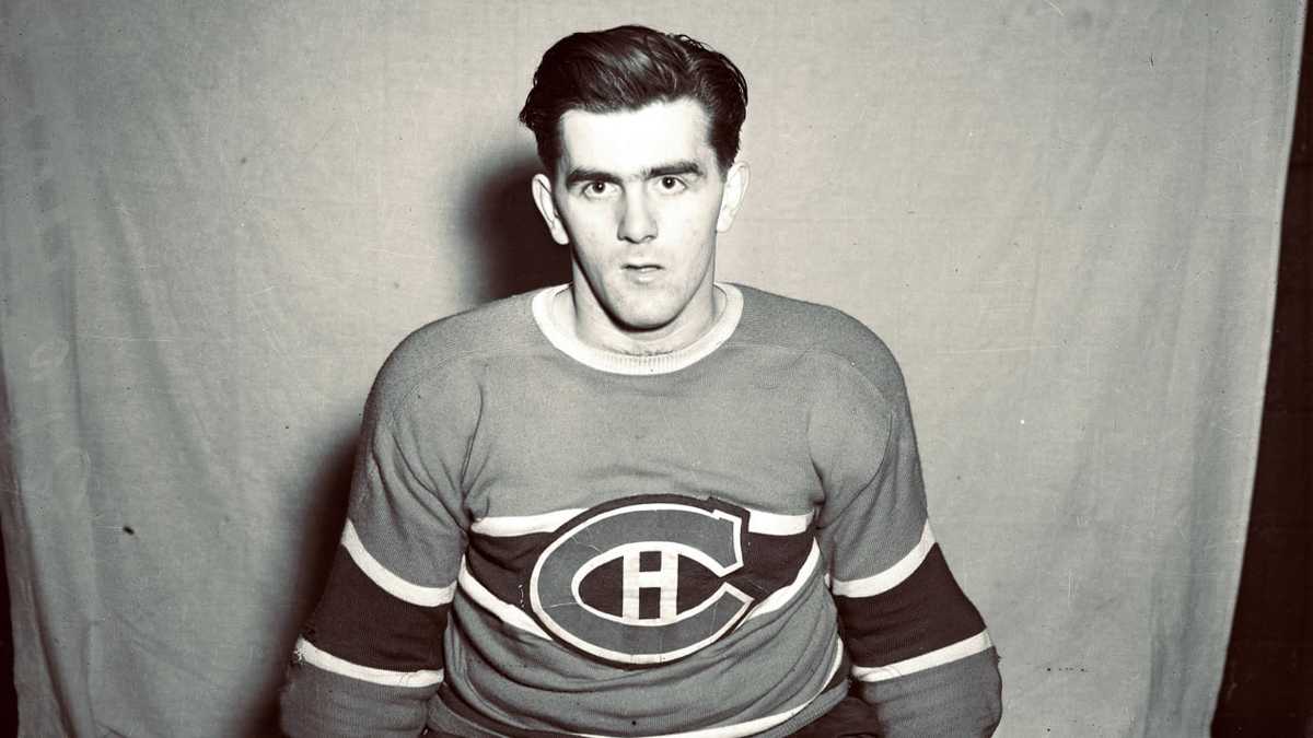 Black-and-white portrait of young Maurice Richard in Montreal uniform looking directly at the camera