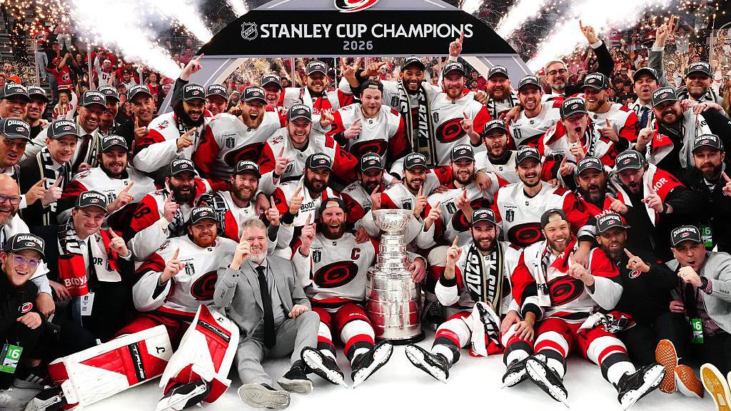 Close-up of the Stanley Cup showing multiple engraved rings with names of past champions